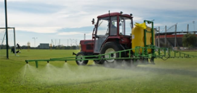 Field being sprayed with protectant